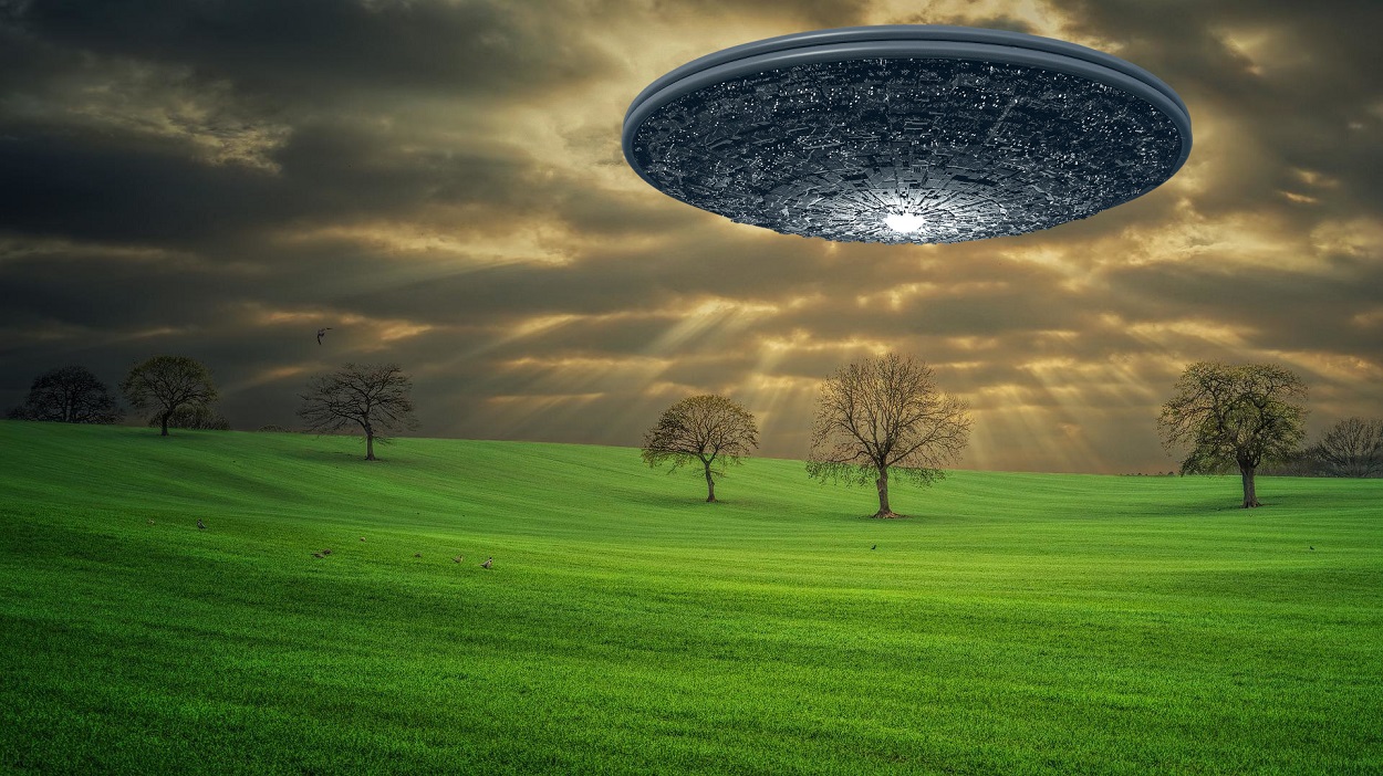 A depiction of a UFO in a field