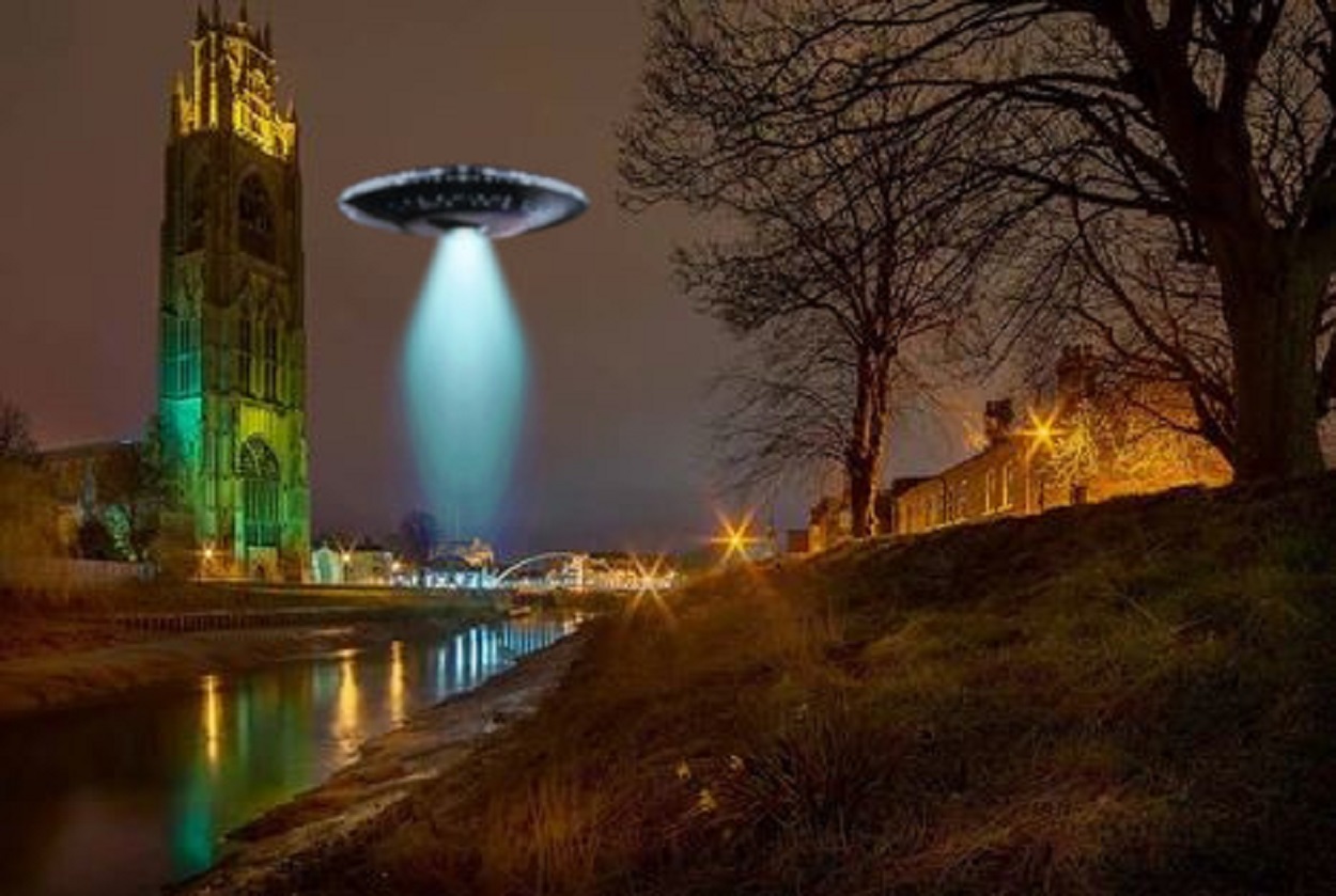 A depiction of a UFO over a town
