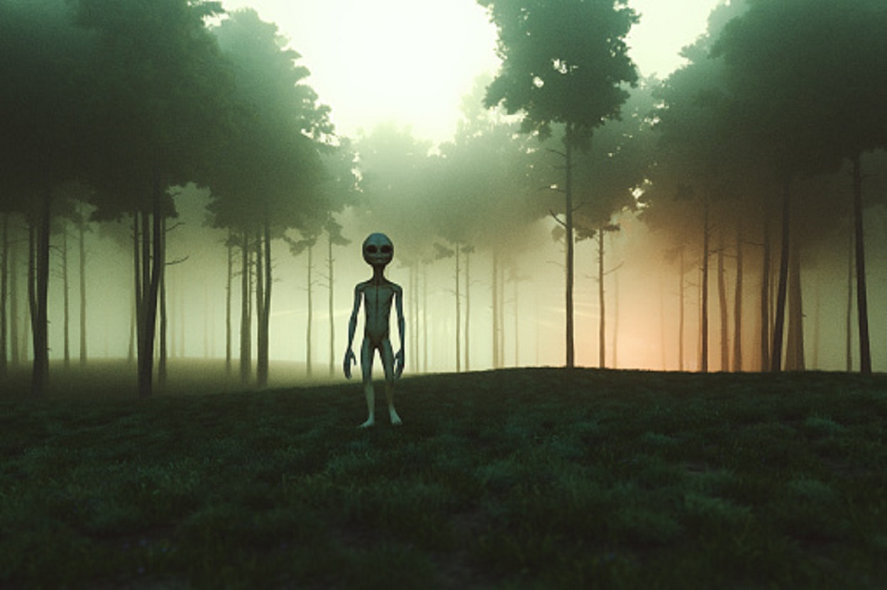 A depiction of an alien in a forest 